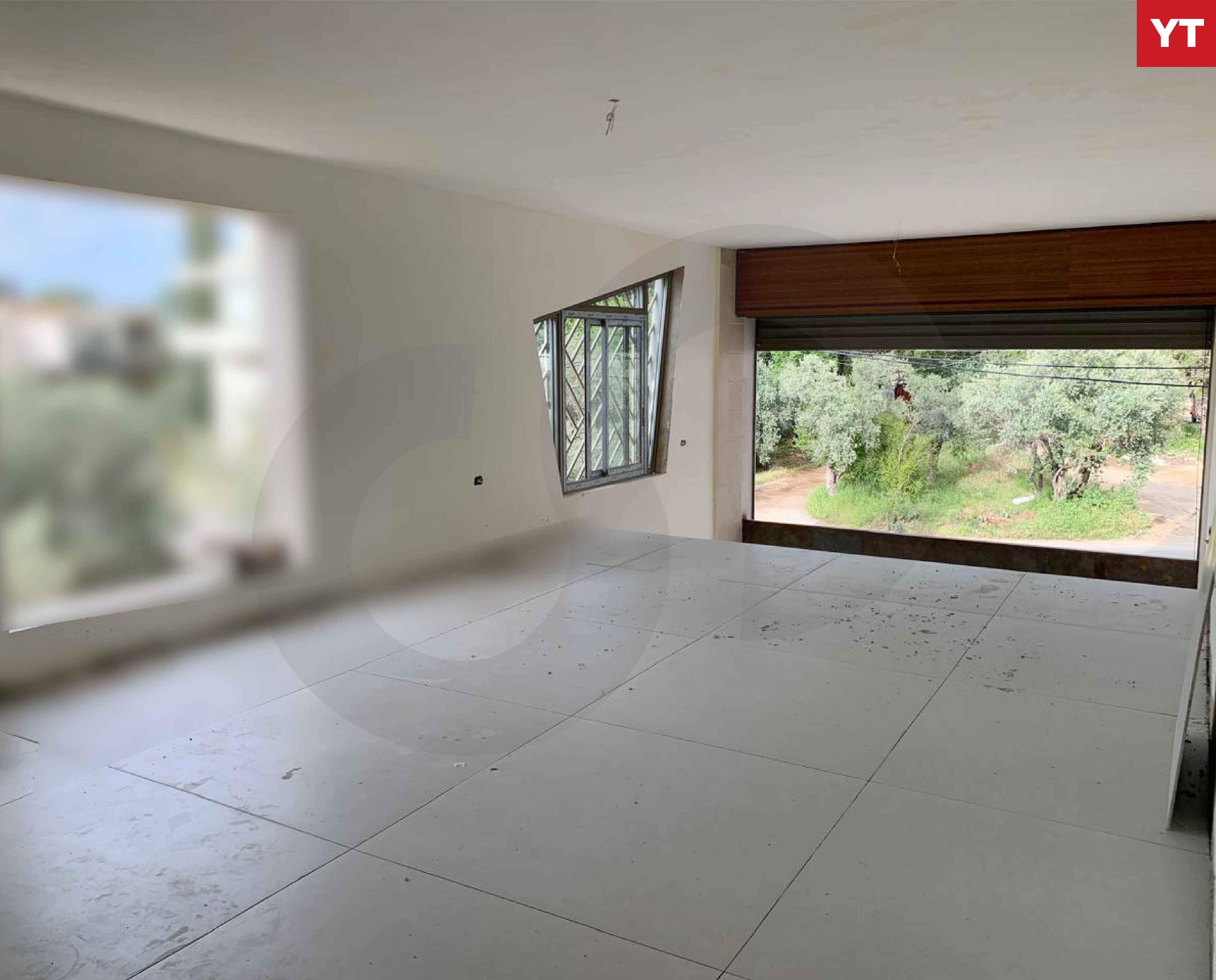SHOP/120 sqm storage area/Amioun, Koura