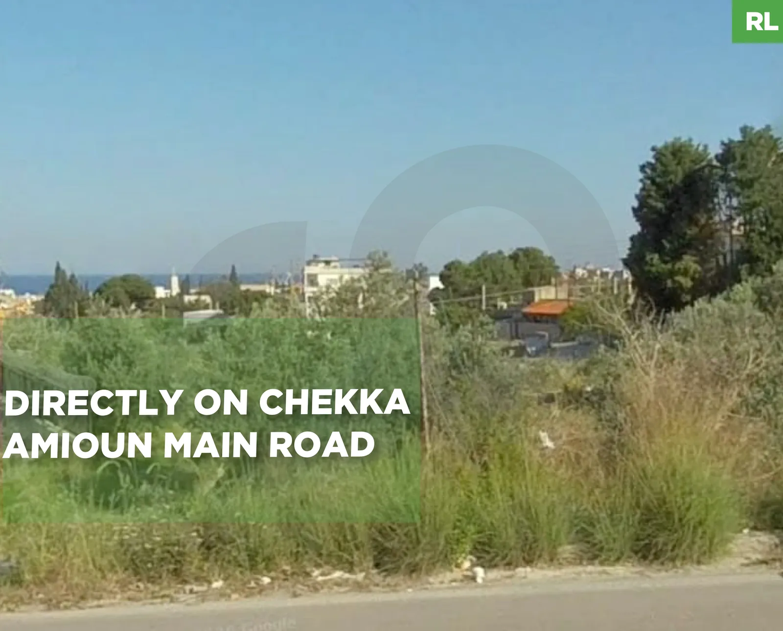 LAND/directly on Chekka - Amioun ,KOURA main road/zoning 50/150