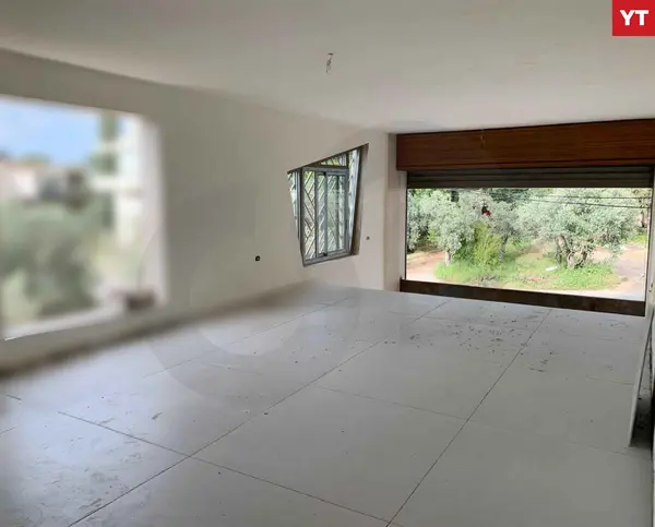 SHOP/120 sqm storage area/Amioun, Koura
