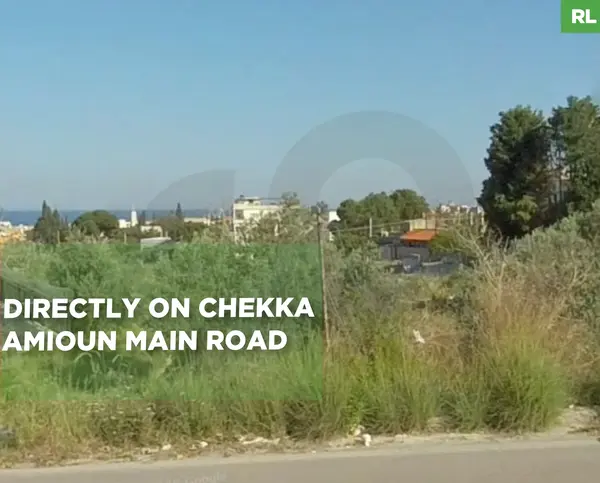 LAND/directly on Chekka - Amioun ,KOURA main road/zoning 50/150